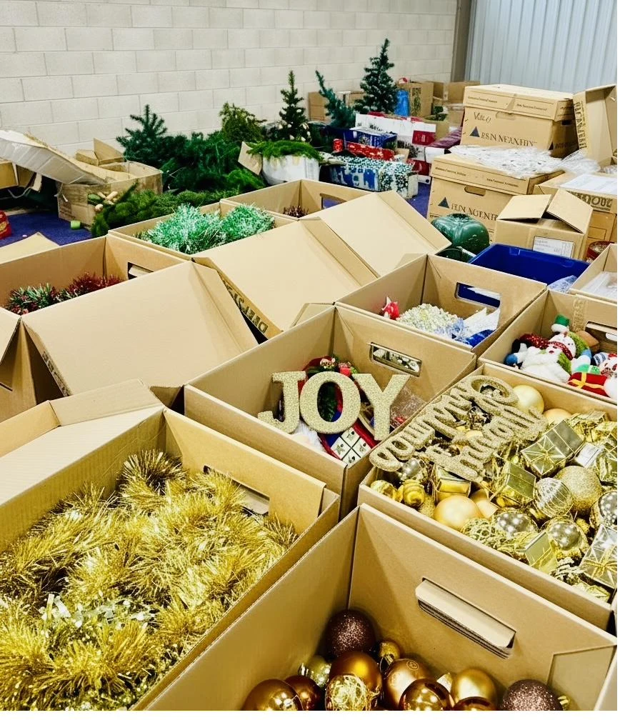 Gold Christmas decorations and a JOY ornament ready for reuse